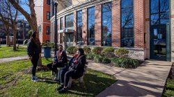 three students talk outside of residence hall on Bloomfield College campus