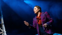 Student performing on stage.